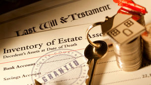 Close-up of Florida probate inventory form, last will and testament, house key, and coins symbolizing estate assets and property transfer during probate