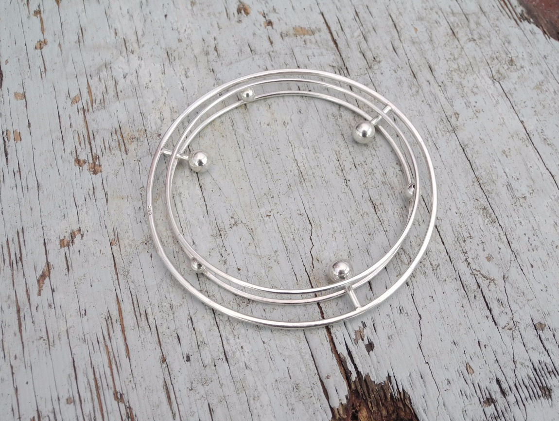 Saturn silver bangle