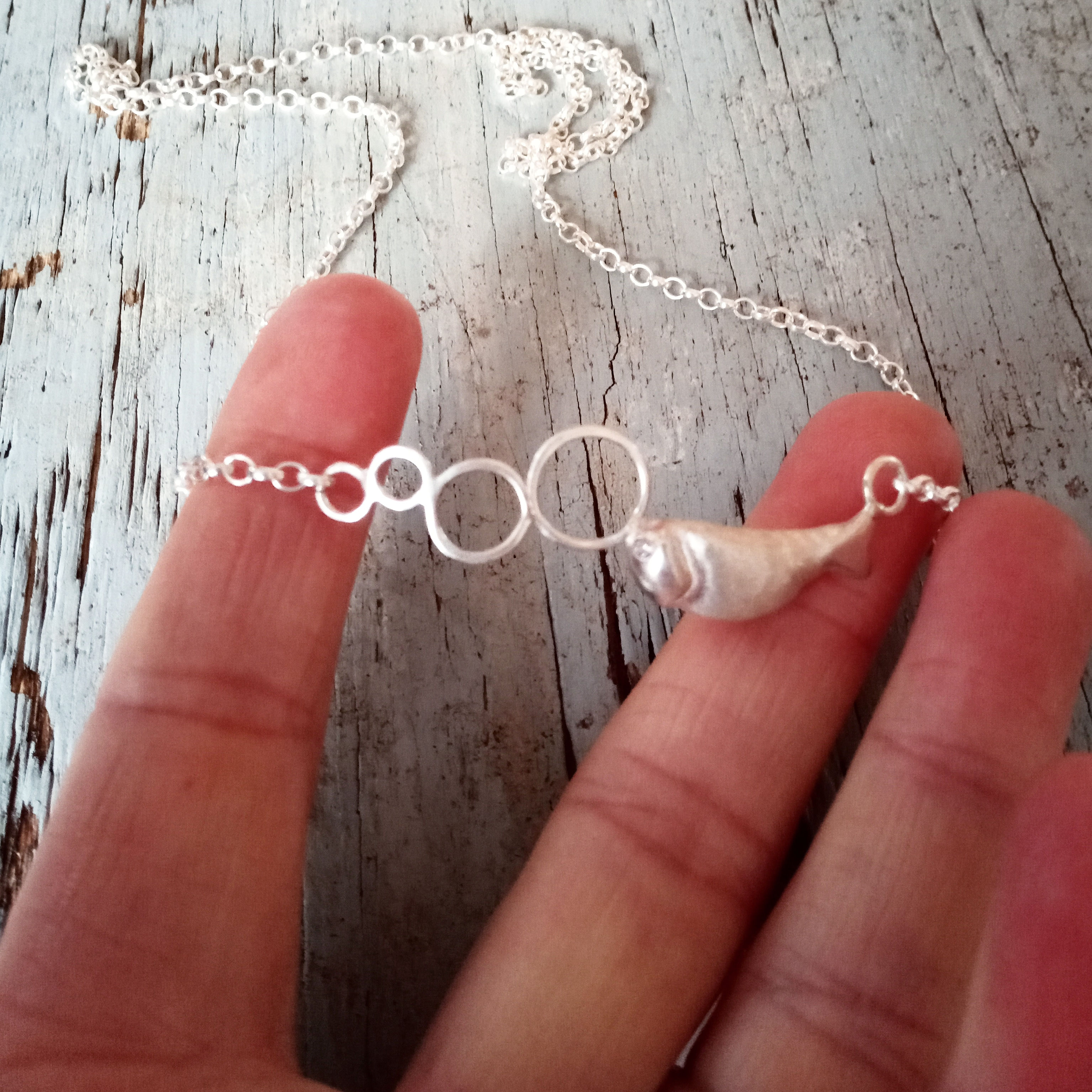 Little silver fish blowing bubbles