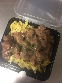 Beef stroganoff featuring tender beef in a creamy sauce.