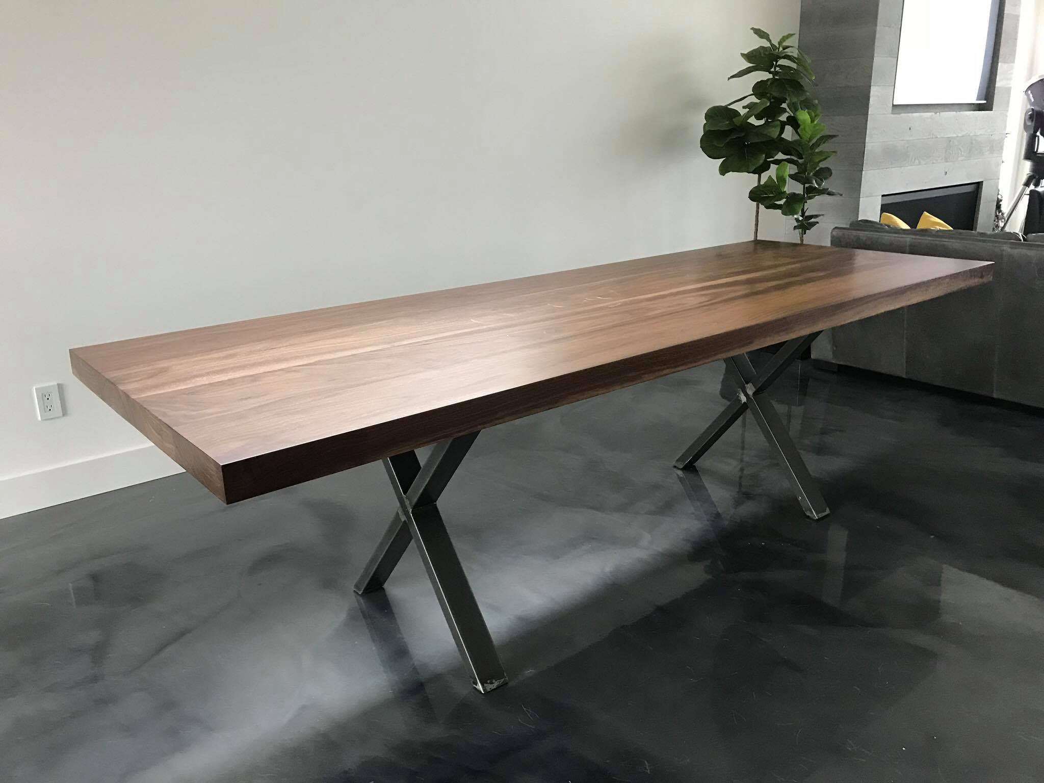 A custom walnut dining table built by Pasquale's Workshop