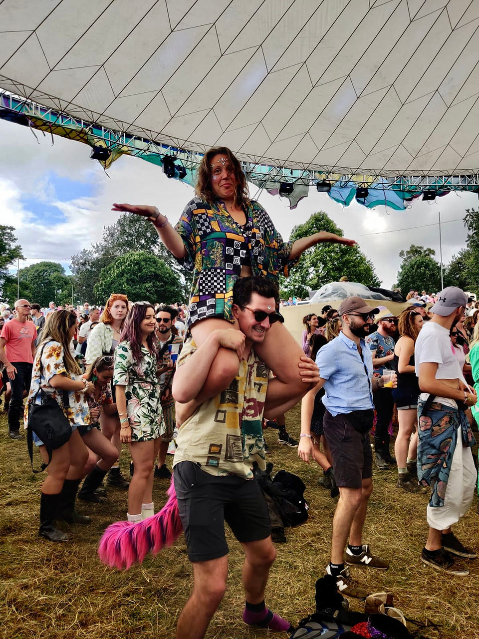 Aimee sat on Conor's shoulders at wilderness festival