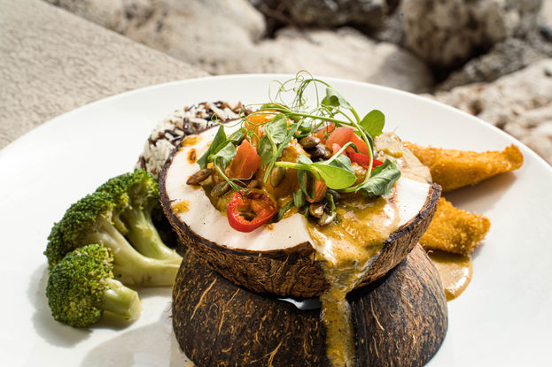 The signature Tides curry is served in a coconut