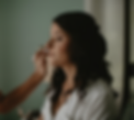 Woman having makeup applied