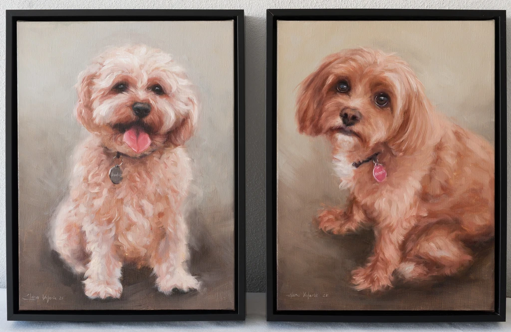 Oil painting diptych of two dogs, one dark and noble, one light with a head tilt.