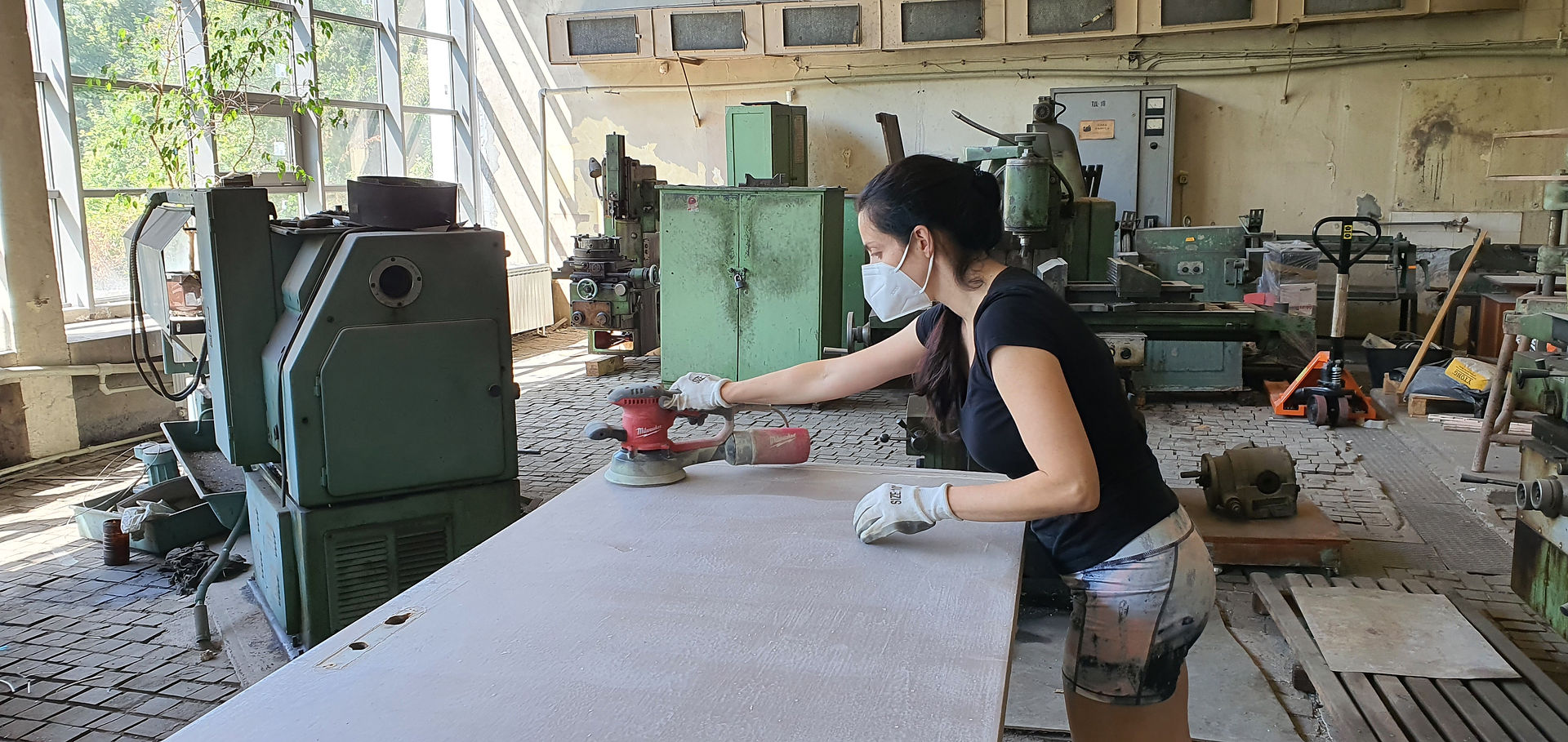 Galina is grinding a door