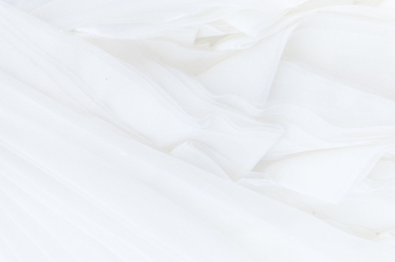white textile in close up photography_ed
