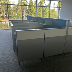 Aisle view of Herman Miller Canvas cubicles with lateral file storage and shelf units.