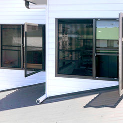 Prowler Proof Hinge Window security screens installed as emergency escape points on the upper-floor windows of this home in Brisbane by Get Real Secure, Stafford Heights.