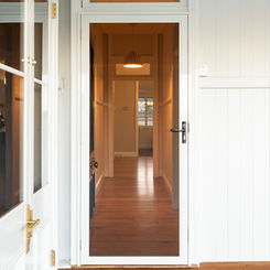 Prowler Proof ForceField hinge door security screen installed on entrance of Kalinga Queenslander home by Get Real Secure, Stafford Heights.