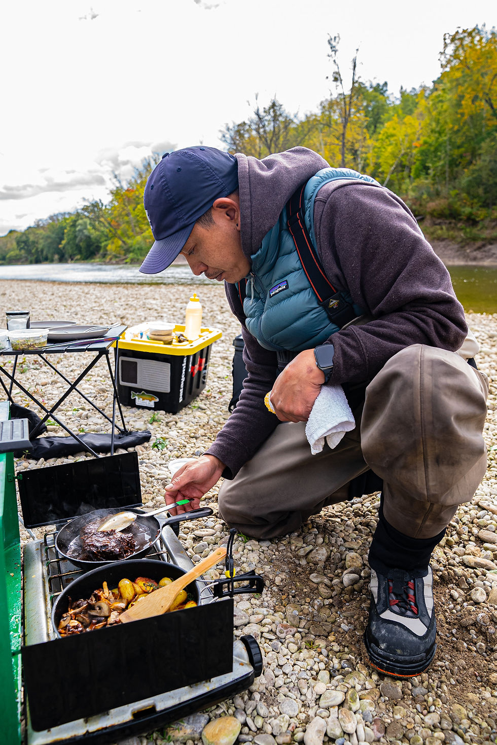 Guide preparing a chef-inspired shore lunch along Ontario’s Grand River.
