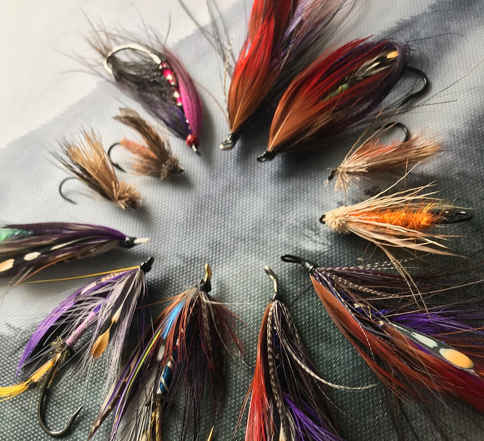 Close-up of handcrafted steelhead flies tied by a River Run Guiding instructor.