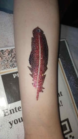 Feather glitter tattoo