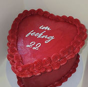 Heart shaped celebration cake with 22 lyric design