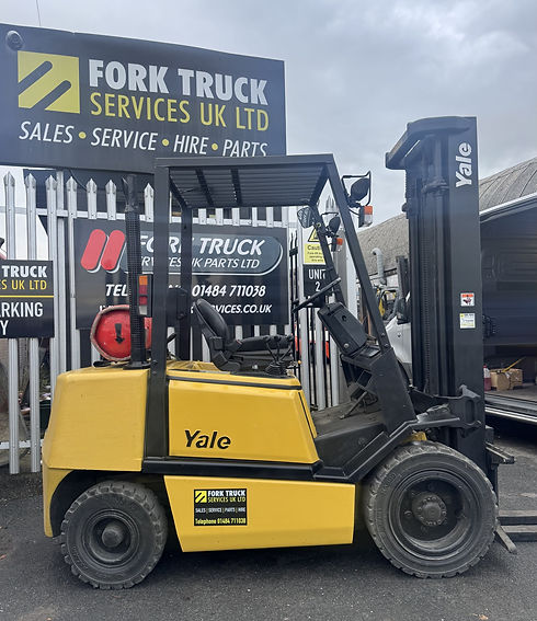 Yellow Yale Forktruck in yard