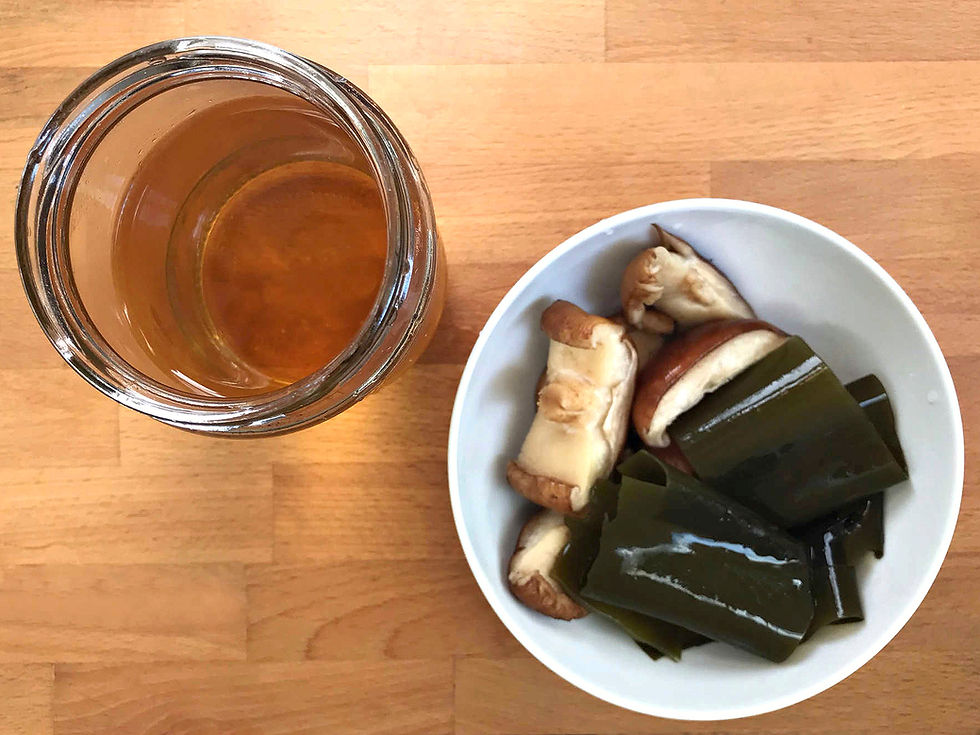 Jar of Vegan Dashi With Bowl of Shiitake Mushroom Pieces and Kombu