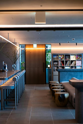 Hotel bar area with neatly lined up seating