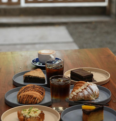 Drinks and pastries on a wooden table top