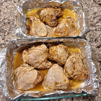 Thighs Arranged in pans with chicken stock