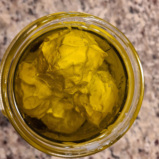 Transfer balls to a clean, sterilized glass jar. Add optional dried spices if using, then completely cover the balls with olive oil. Ensure no part of the labaneh is exposed to air.