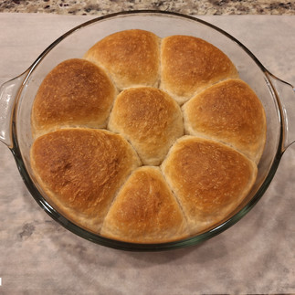 Brush with a mix of melted butter, sugar, and almond extract while still warm.
