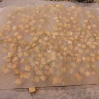 Peel and dice the eggplant finely. Sprinkle lightly with salt and let it sit for 10-15 minutes to draw out bitterness. Pat dry with paper towels.