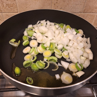 Heat butter in a pan over medium heat and sauté the leeks and onion until very soft (about 10-12 minutes). Let cool slightly. Blend the sautéed leeks, onion, and egg until smooth.