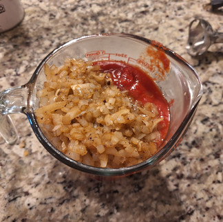 In a blender, combine the cooked onions and garlic with the canned tomatoes (including juices). Blend until silky smooth. Return the puréed sauce to the pan. Season with salt and pepper. Taste and add 1 teaspoon sugar if it seems too acidic.