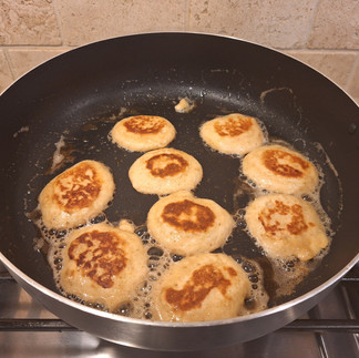 Drop spoonfuls of batter (about 1 tablespoon each) to form small pancakes. Cook for 2–3 minutes, until bubbles form on the surface, then flip and cook for 1–2 minutes until golden.