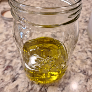 Transfer balls to a clean, sterilized glass jar. Add optional dried spices if using, then completely cover the balls with olive oil. Ensure no part of the labaneh is exposed to air.