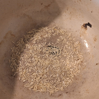 I like to put dry rice at the bottom of the Dutch oven for non-burnt bottom.