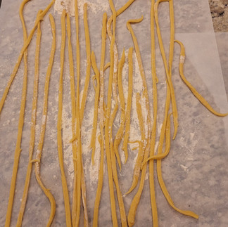 Divide the dough into 4–6 portions. Roll each piece to your desired thickness using a pasta machine or rolling pin. Stack rolled sheets between floured parchment paper if needed. Then cut into fettuccine, tagliatelle, pappardelle, or your favorite shape.