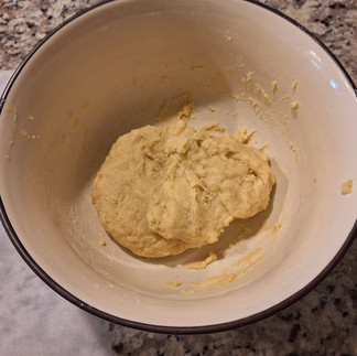 Gradually mix the wet ingredients into the dry until a sticky dough forms. Lightly flour your hands and roll the dough into 1-inch balls.