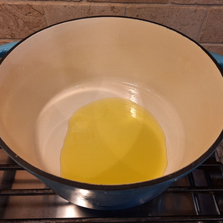 While the meatballs are baking, heat 1½ tbsp olive oil in a Dutch oven over medium heat. Add the diced potatoes and sliced carrots, sautéing for 4-5 minutes. Stir in the rice, turmeric, oregano, salt, and black pepper, coating everything in the oil.