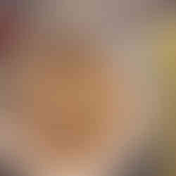 single tenderloin dipped in bread crumbs, in a bowl, uncooked