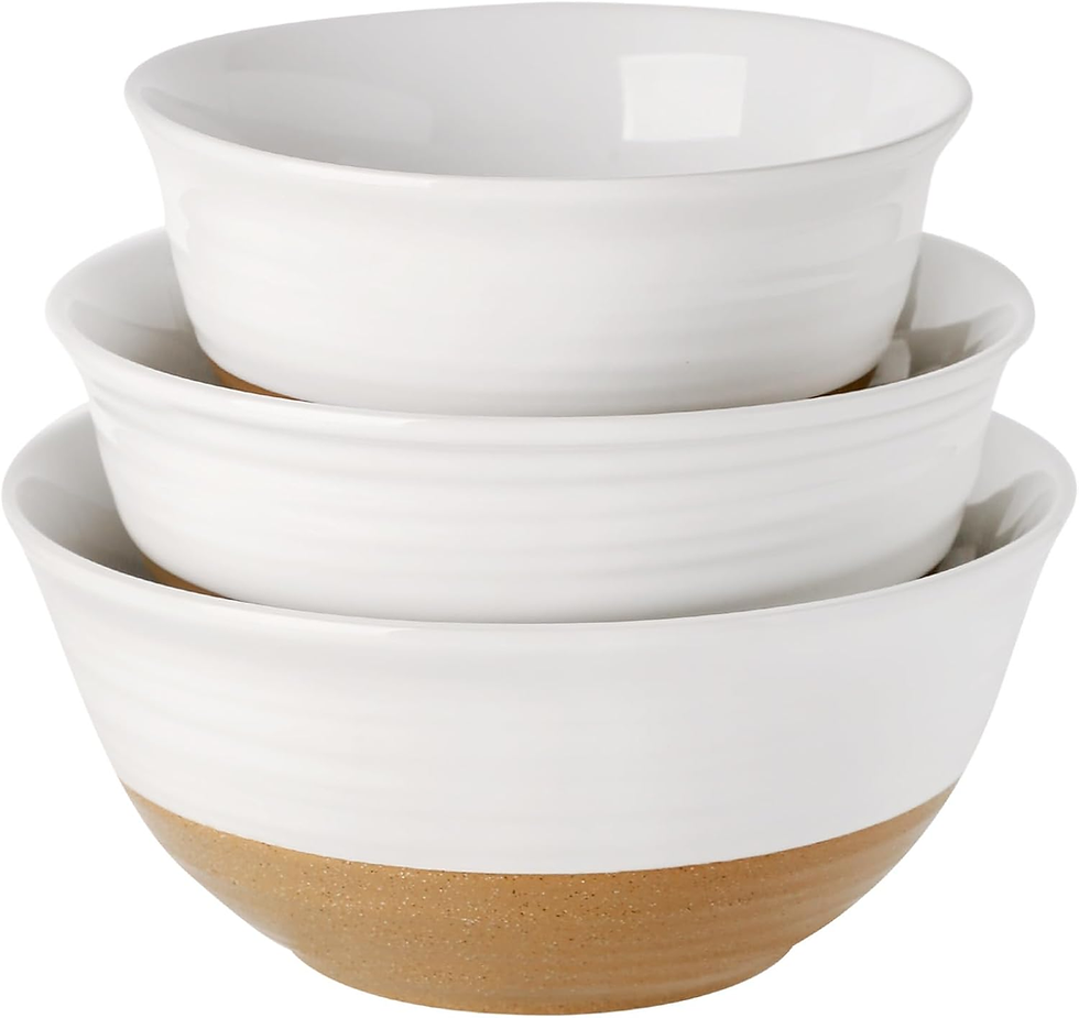 Three stacked white ceramic bowls with a brown base, arranged against a plain background. Simple design, no visible text.