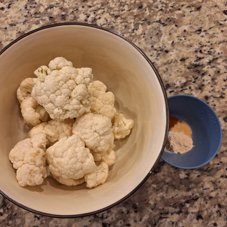 1 medium head cauliflower, cut into bite-sized florets 2 tablespoons olive oil (or avocado oil) ½ teaspoon garlic powder ¼ teaspoon onion powder ½ teaspoon paprika (regular, not smoked) ¼ teaspoon black pepper ½ teaspoon salt