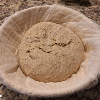 Gently shape the dough into a round or oval on a lightly floured surface. Place seam-side up in a floured banneton or parchment-lined bowl. Cover and let proof for another 1.5 to 2 hours until soft, airy, and springy to the touch.