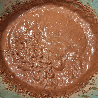 Stir in the hot water or coffee until the batter is smooth.