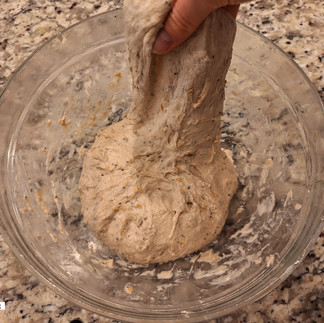 Perform 3 sets of stretch-and-folds over 90 minutes, every 30 minutes: Grab one side of the dough, stretch it upward, fold over the center. Rotate bowl and repeat on all sides. This builds structure without intensive kneading.