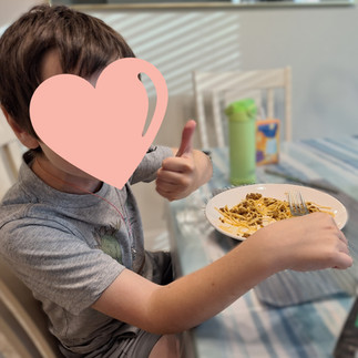 Boy eating Spaghetti Bolognese