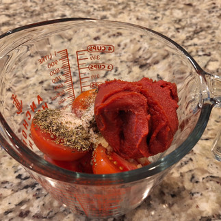 Blend tomatoes, garlic, brown sugar, and tomato paste.