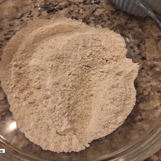 In a medium bowl, whisk together flour, baking powder, baking soda, cinnamon, nutmeg (if using), and salt.