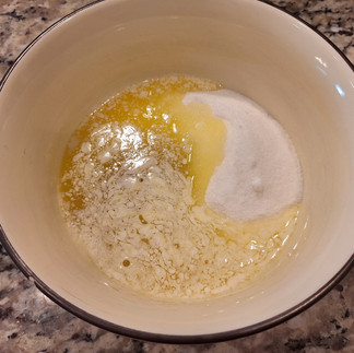 In a separate large bowl, whisk together sugar, brown sugar, and melted butter until smooth. Add eggs and vanilla, mixing well.