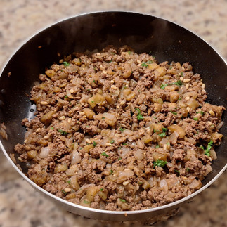 All ingredients for filling, cooked, in a skillet, on countertop set to cool