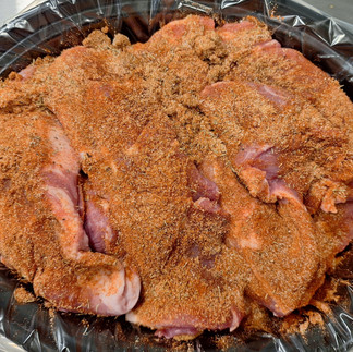 Sprinkle the pork with brown sugar, paprika, garlic powder, onion powder, thyme, salt, and pepper.