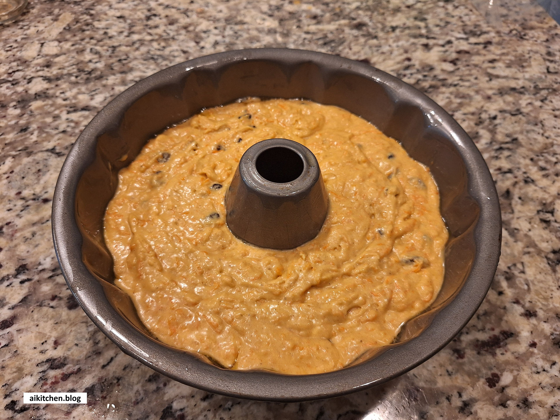 Pour into your prepared pan and tap gently to release bubbles.