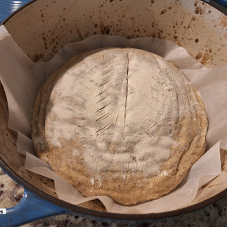 Preheat oven to 475°F (245°C) with a Dutch oven inside for at least 30 minutes. Turn the dough out onto parchment, score with a sharp blade or lame, and carefully place into the preheated Dutch oven. Bake covered for 20 minutes Then uncover, reduce temperature to 450°F (230°C), and bake another 20–25 minutes until deeply golden and internal temperature reaches ~205°F (96°C).