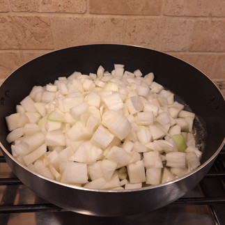 Heat butter in a large skillet over medium heat. Add onions and sauté until golden and caramelized, about 10-12 minutes. Remove and set aside.