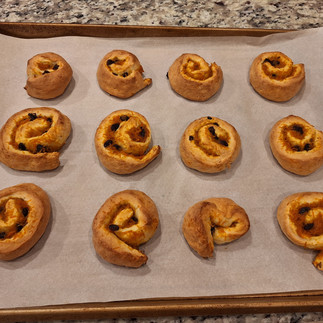 Bake for 18–20 minutes, or until golden and cooked through. While still warm, brush tops with melted butter and sprinkle with coconut sugar. Let cool slightly before serving.